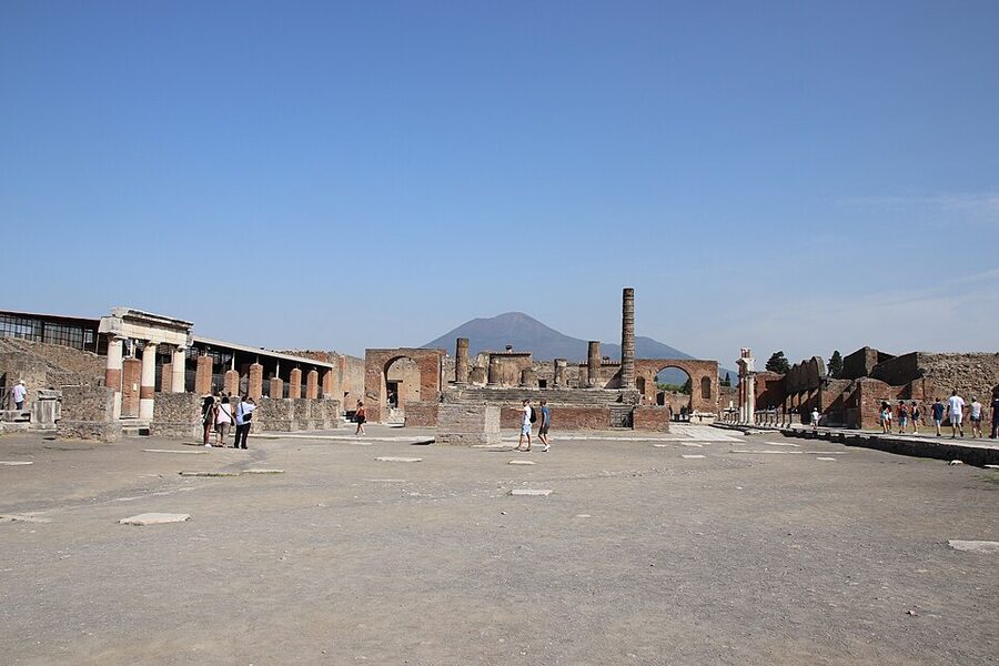 Pompeii forum ruins with Mount Vesuvius behind
