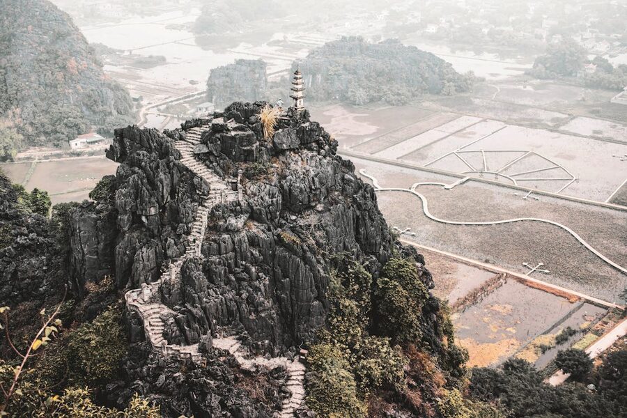 Aerial view of Mua Cave staircase winding up a rocky hill in Ninh Binh Vietnam