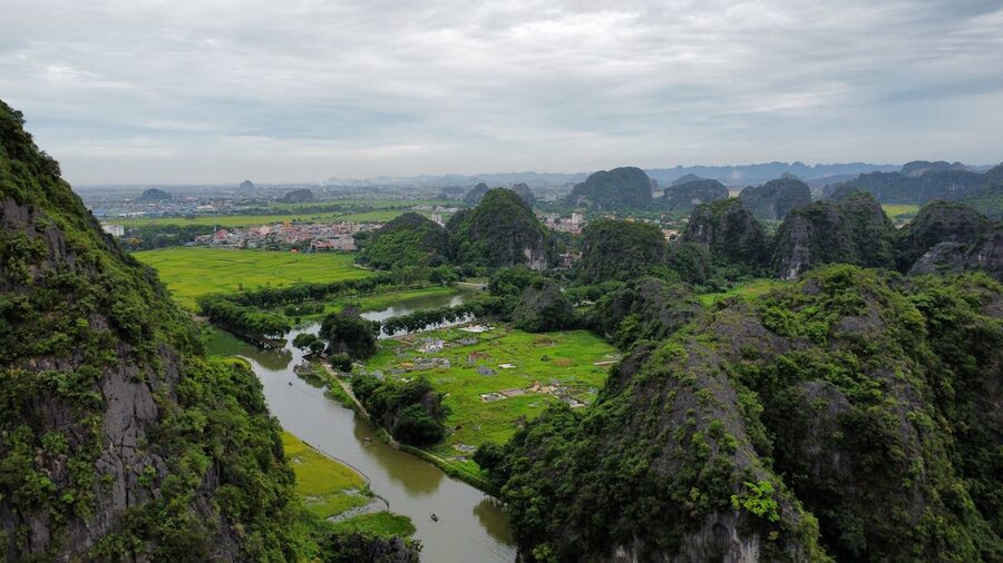 Stunning aerial shot of lush limestone mountains and green landscapes in Ninh Binh Vietnam