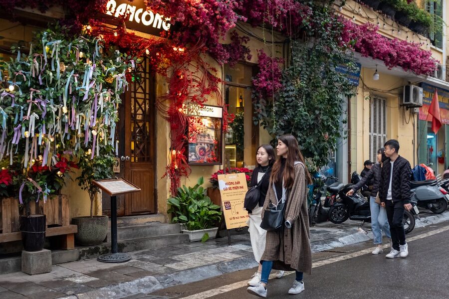 Colorful street with pedestrians in Hanoi Vietnam showcasing local culture