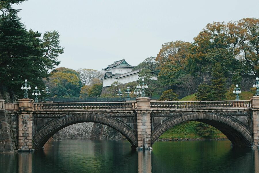 Elegant Nijubashi Bridge at the Imperial Palace surrounded by lush green trees in Tokyo