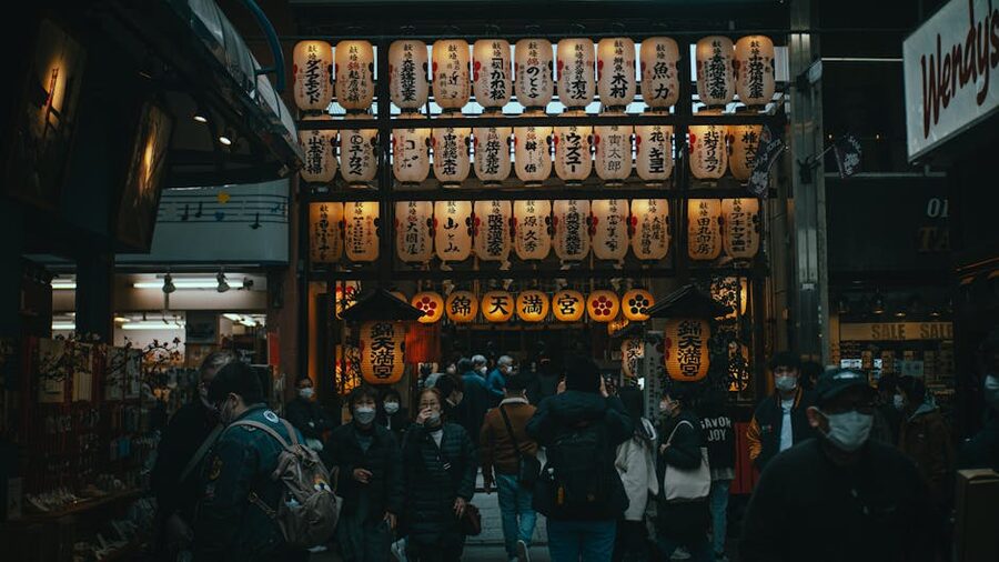 Nishiki Tenmangu Shrine entrance with visitors in Kyoto
