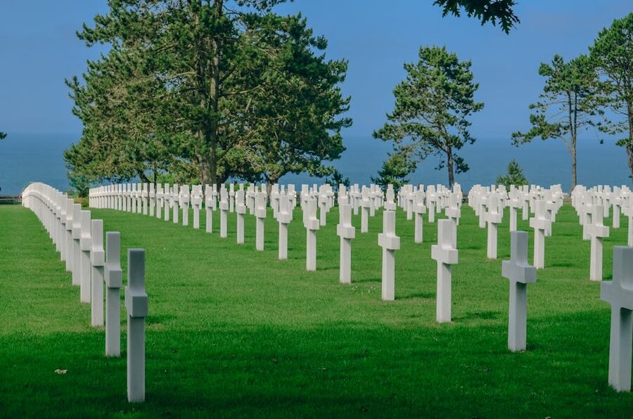 Normandy American Cemetery overlooking Omaha Beach with rows of white crosses