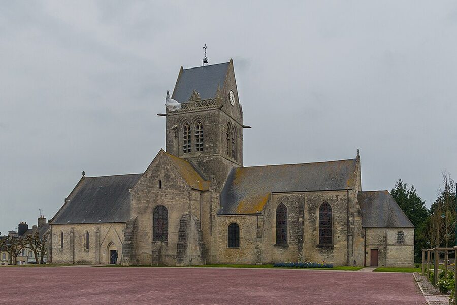Paratrooper effigy hanging from the church spire at Sainte-Mère-Église