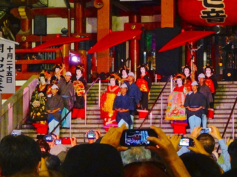 Night oiran parade recreation in Japan with traditional costumes