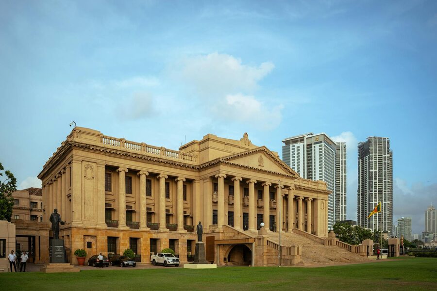 Colombo Old Parliament Building framed by modern skyscrapers