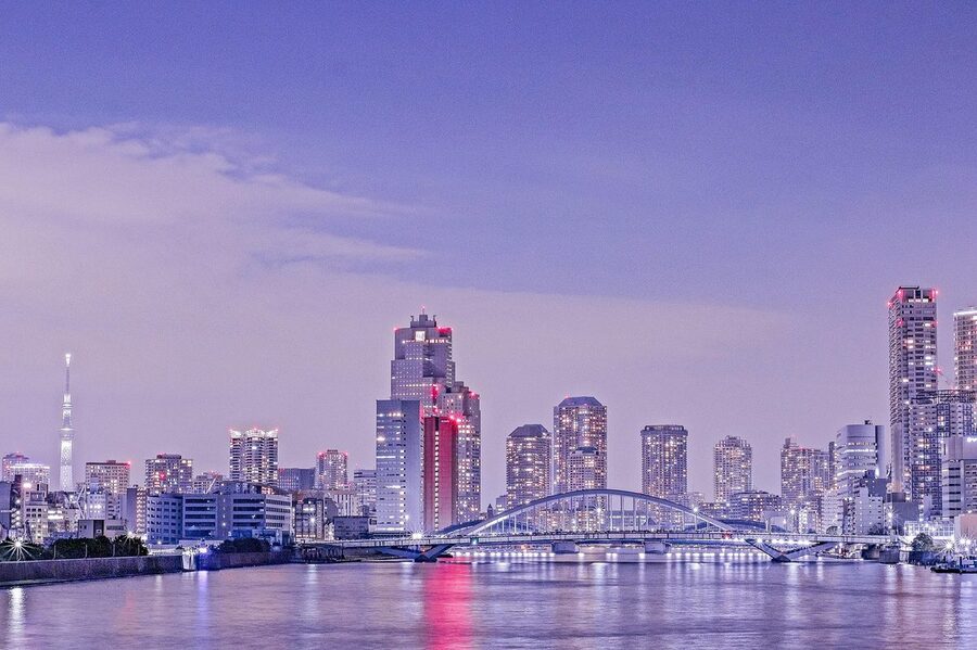 Waterfront pier area along the Sumida River with Tokyo Skytree visible