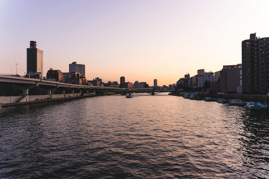 Golden sunset over Tokyo skyline and Sumida River