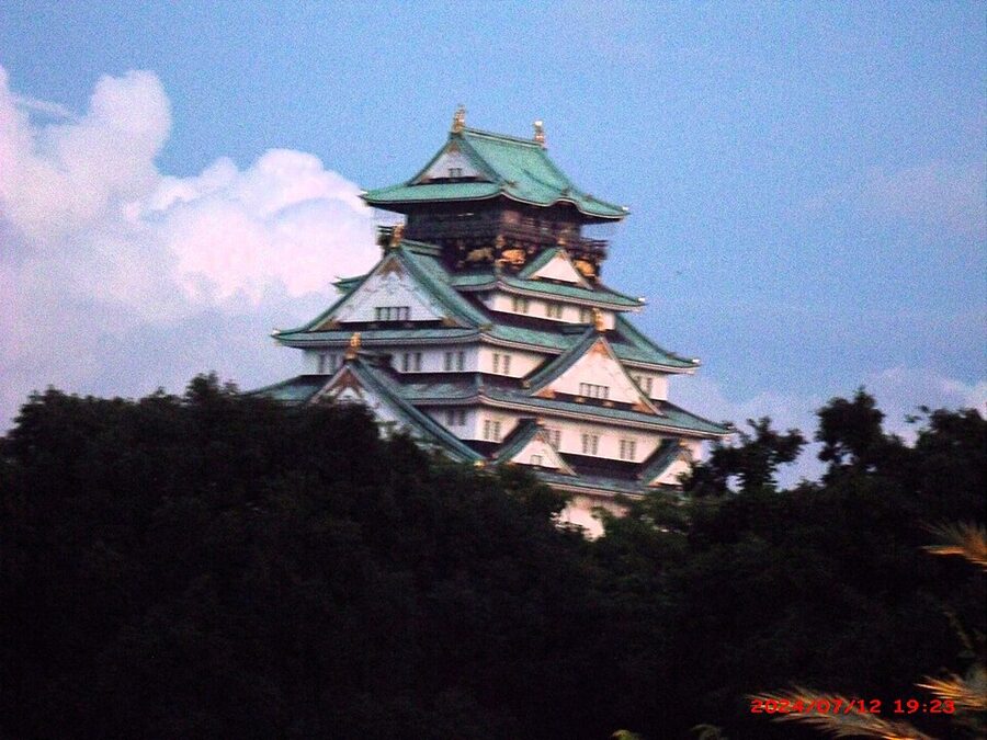 Osaka Castle keep photographed in evening light July 2024