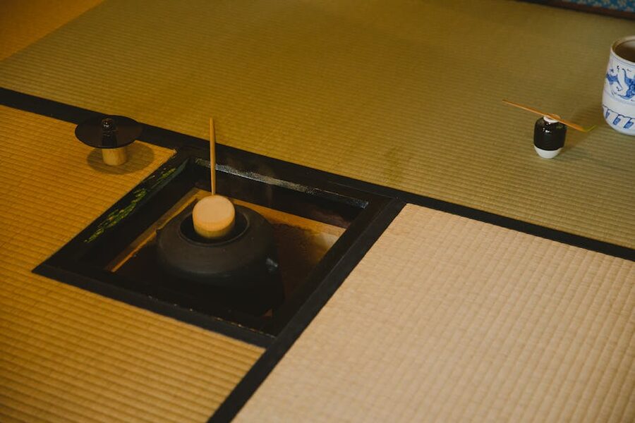 Formal Urasenke-style tea ceremony room with floor kettle and utensils