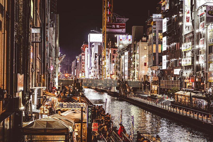 Dotonbori canal Osaka with neon signs reflected in the water at night