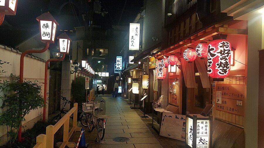Hozenji Yokocho alley Osaka at night with paper lanterns
