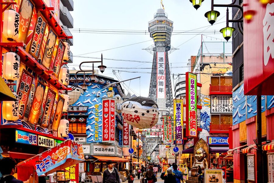 Shinsekai Osaka alley with Tsutenkaku Tower framed at the end