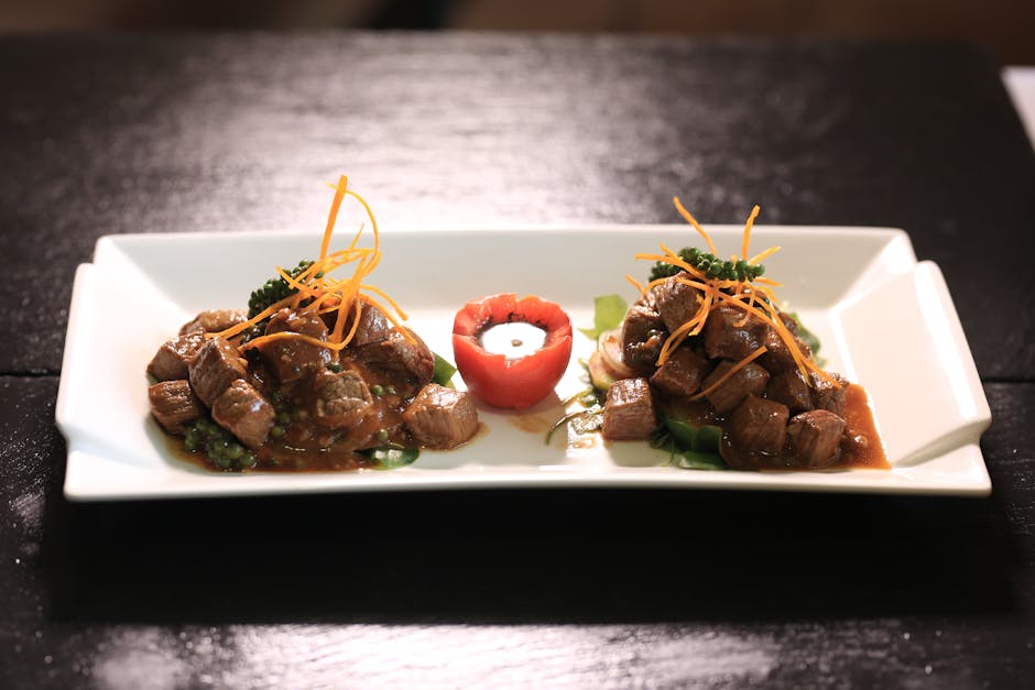 Cambodian beef dish plated with fresh herbs and sauce