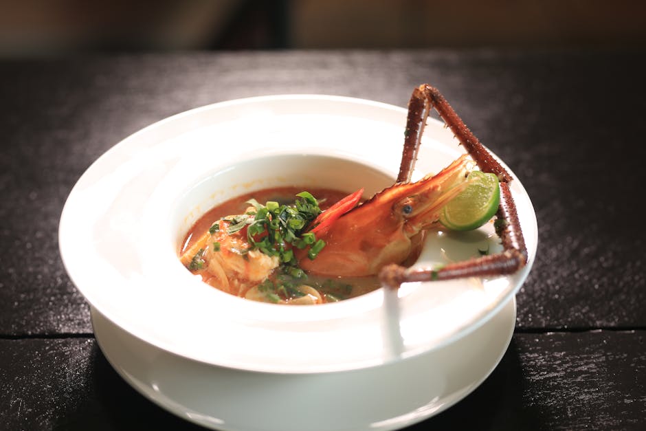 Cambodian seafood soup served in a bowl with fresh lobster