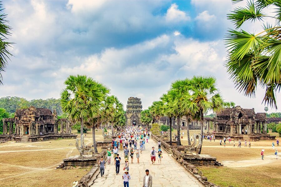 Visitors walking around the Angkor Wat temple complex
