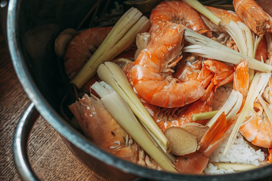 Preparation of shrimp soup with lemongrass in a cooking pot