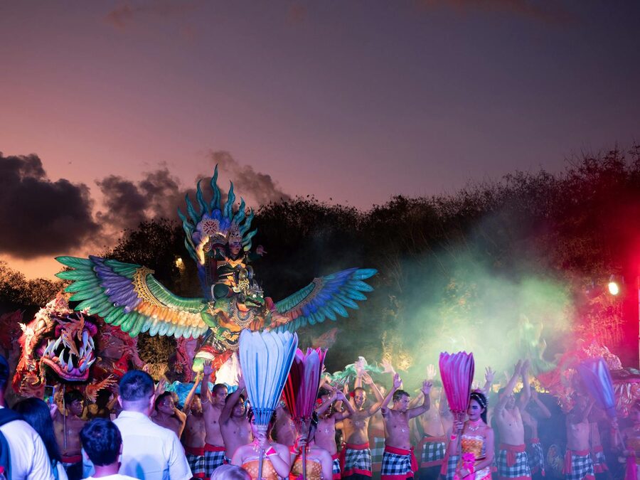 Lively dance performance with traditional costumes and masks in Bali