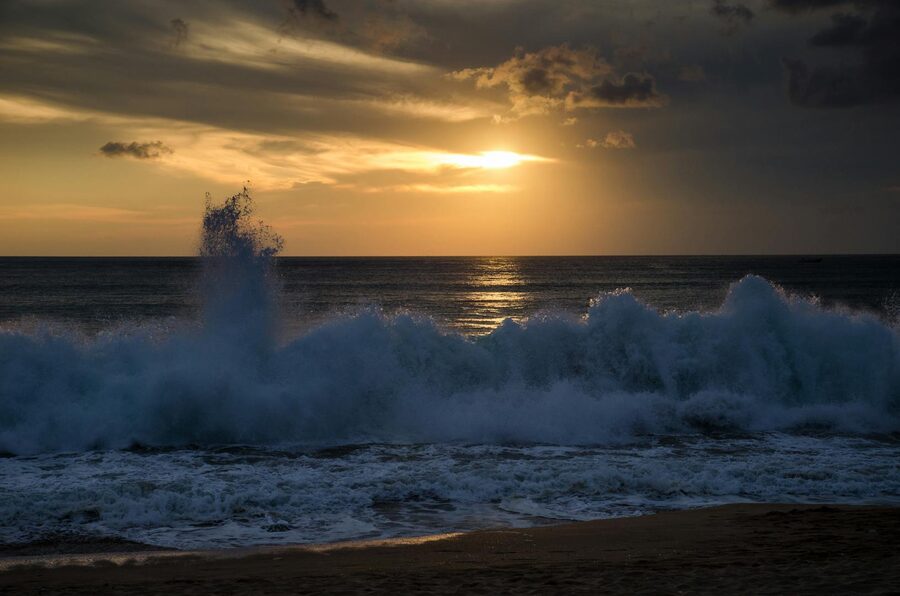 Sunset over Jimbaran Bay on Bali beach