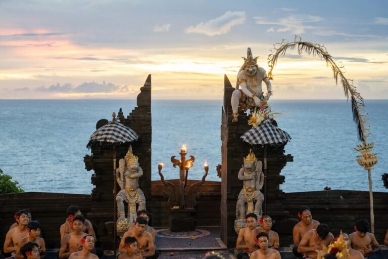 Kecak dancers performing at Uluwatu Temple at sunset