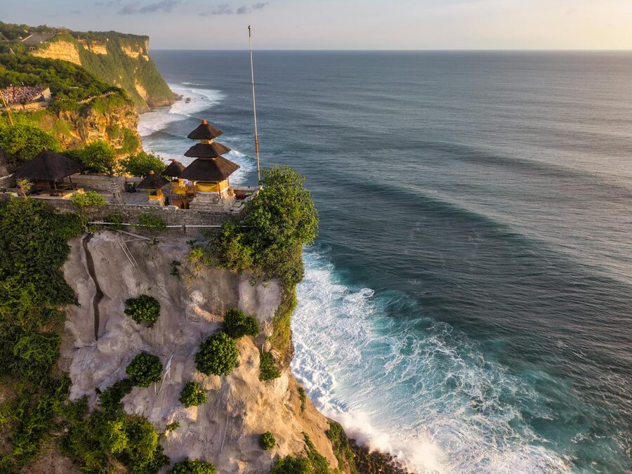 Uluwatu Temple perched on Bali cliffs at sunset