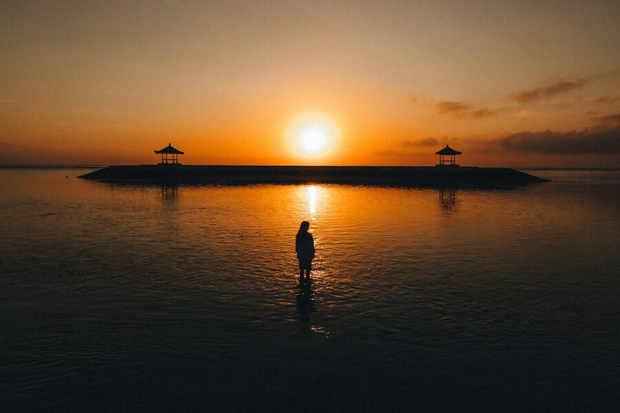 Morning light over traditional fishing boats at Padang Bai harbor on the east coast of Bali