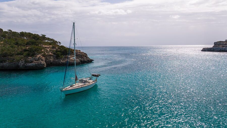 Catamaran anchored in serene Mallorca cove
