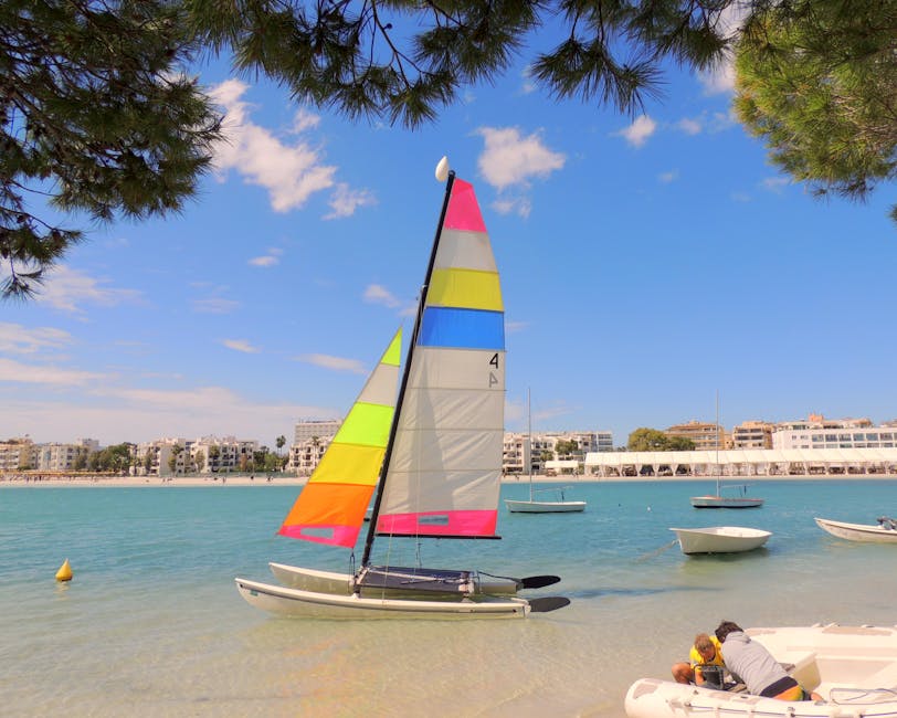 White catamaran sailing off Palma de Mallorca coast