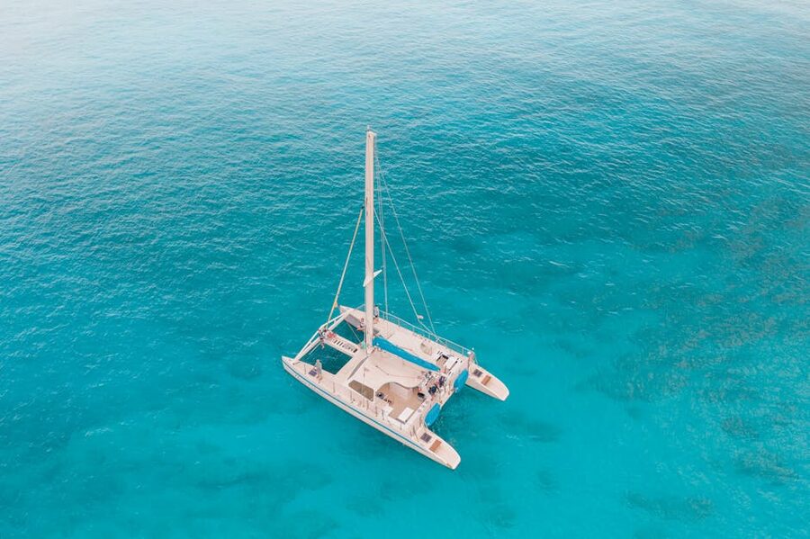 Aerial view of catamaran in turquoise Mallorca waters