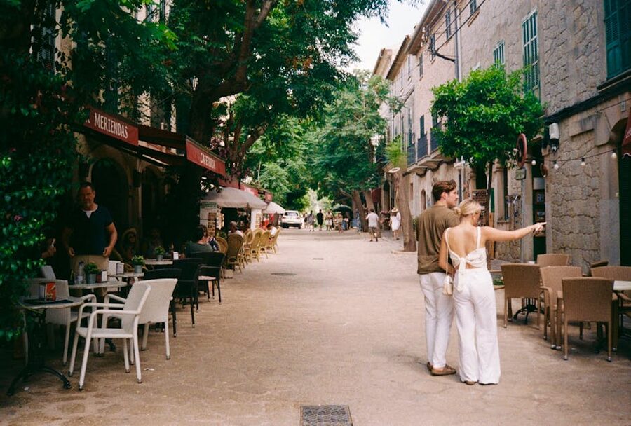Couple walking down a Palma de Mallorca old town street