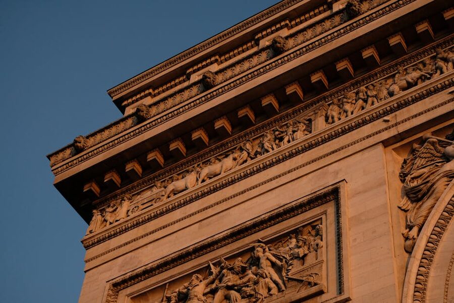 Detailed carved ornaments on the facade of the Arc de Triomphe