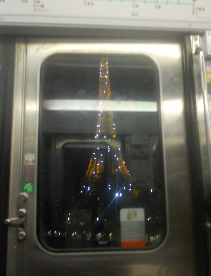 Eiffel Tower sparkling at night with golden lights