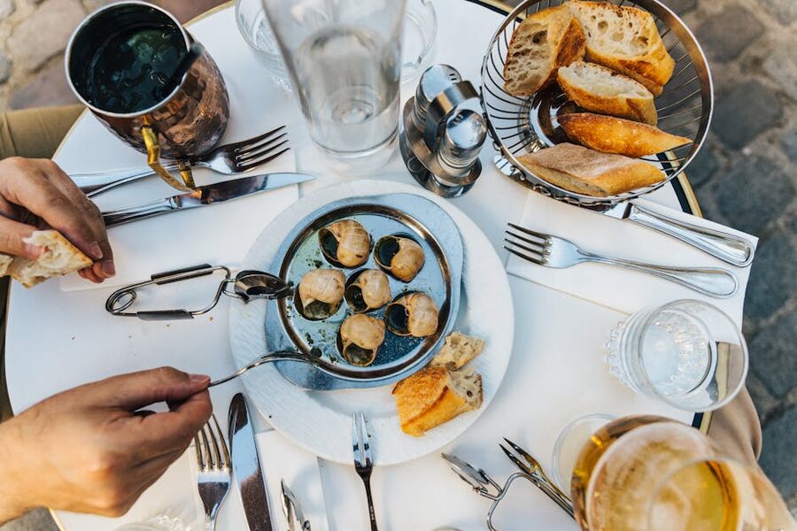 French escargot starter dish with baguette