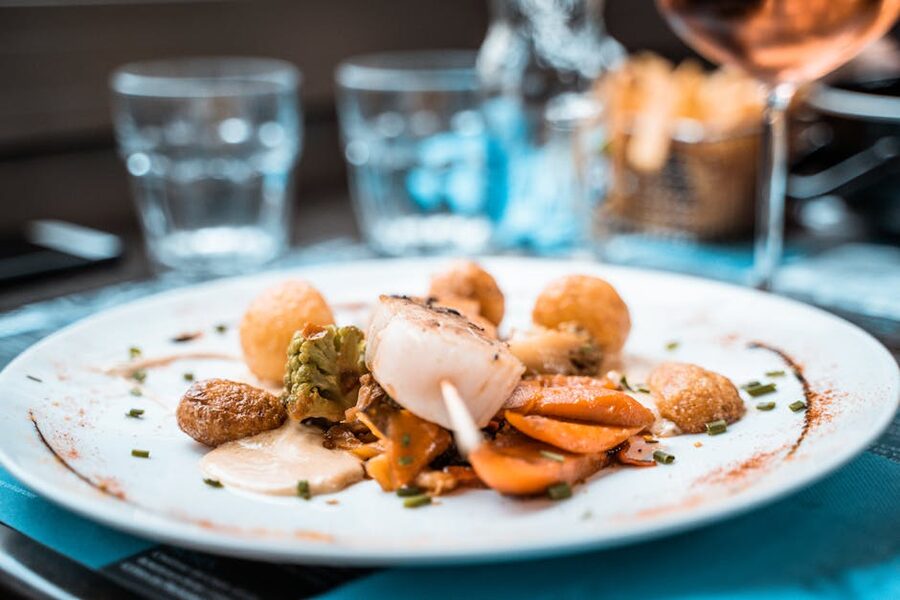 Plated French scallop dish in restaurant