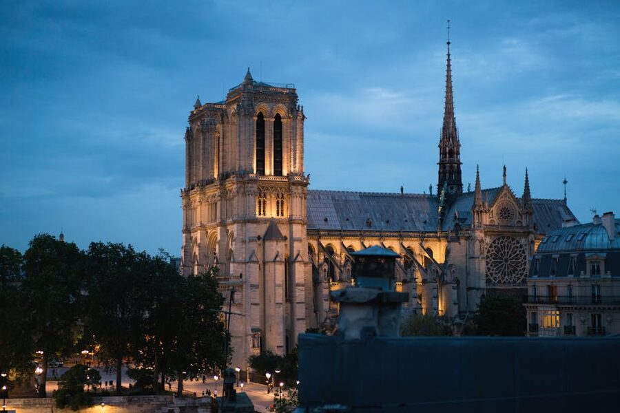 Notre Dame Cathedral lit up at dusk in Paris
