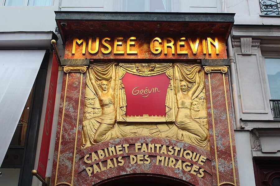 Detail of the gilded bas-relief above the Musee Grevin entrance Paris