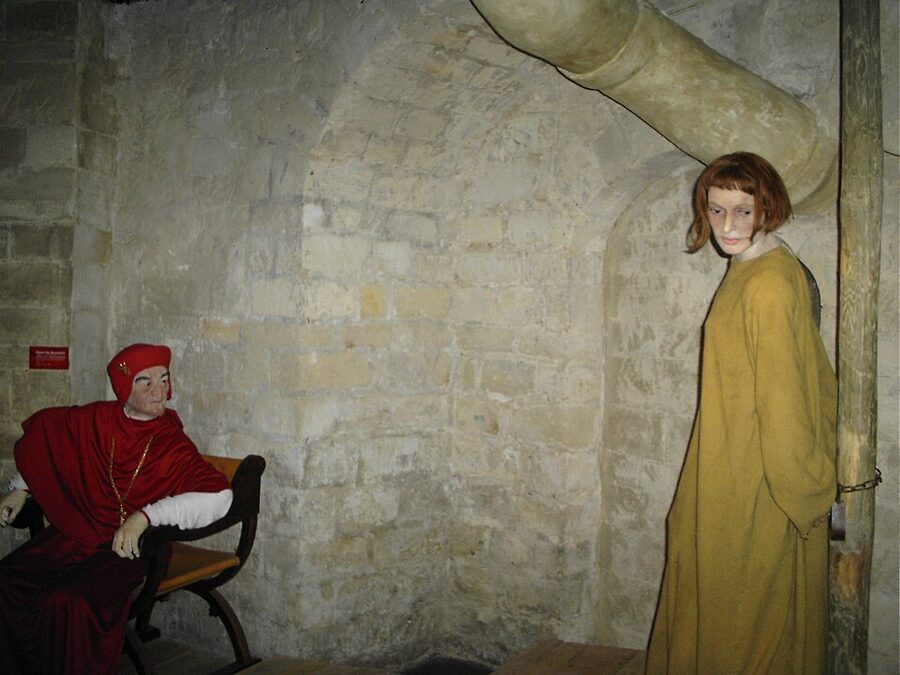 Joan of Arc tableau scene with cardinal figure at Musee Grevin Paris