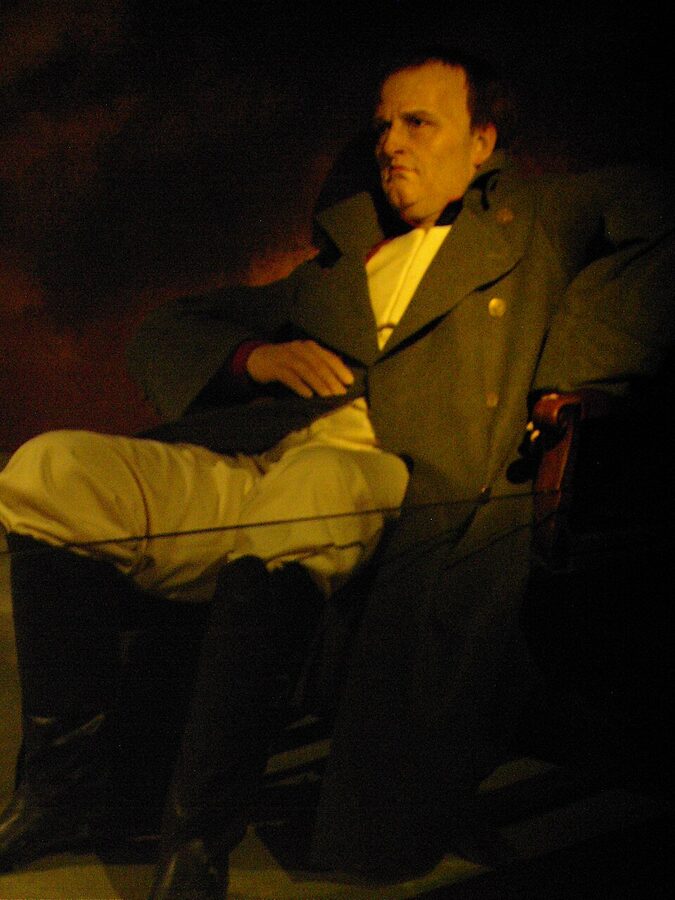 Napoleon Bonaparte wax figure seated in greatcoat at Musee Grevin Paris
