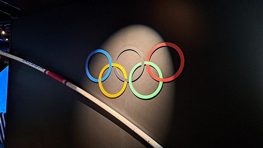 Olympic rings display with pole vault pole at Musee Grevin Paris sport section