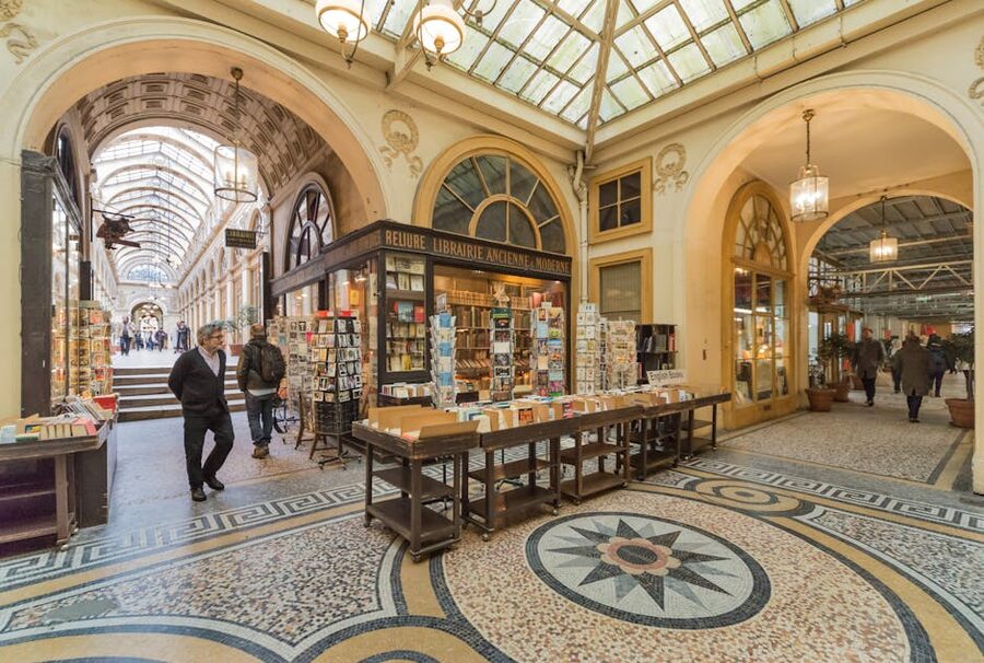 Parisian shopping arcade with vintage bookstore and mosaic floor