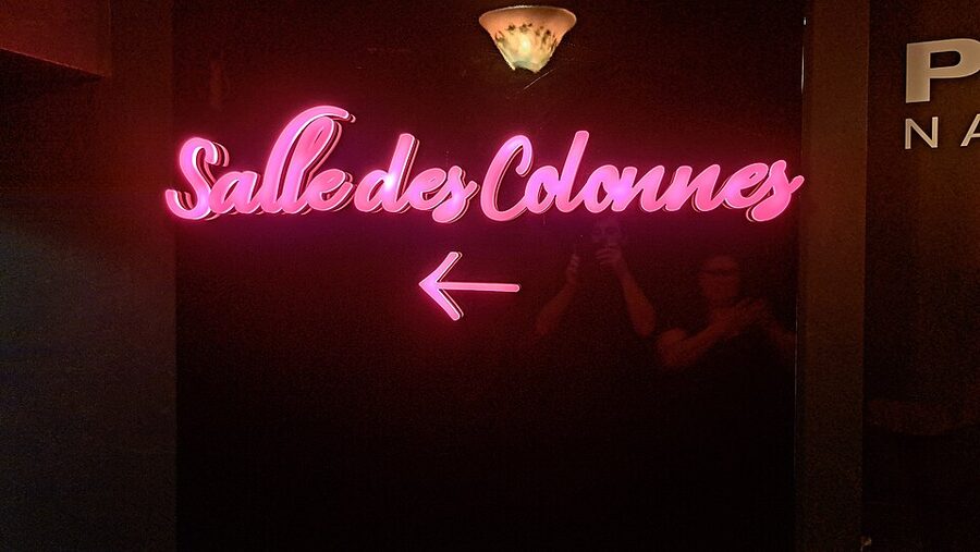 Salle des Colonnes pink neon section sign at Musee Grevin Paris