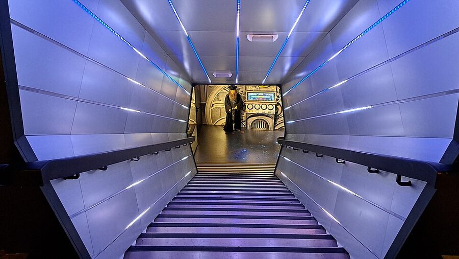 Themed staircase corridor with blue lighting at Musee Grevin Paris