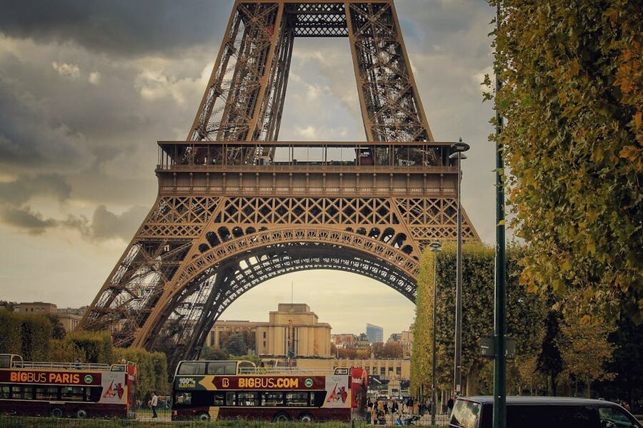 Eiffel Tower with sightseeing buses on the avenue below in Paris