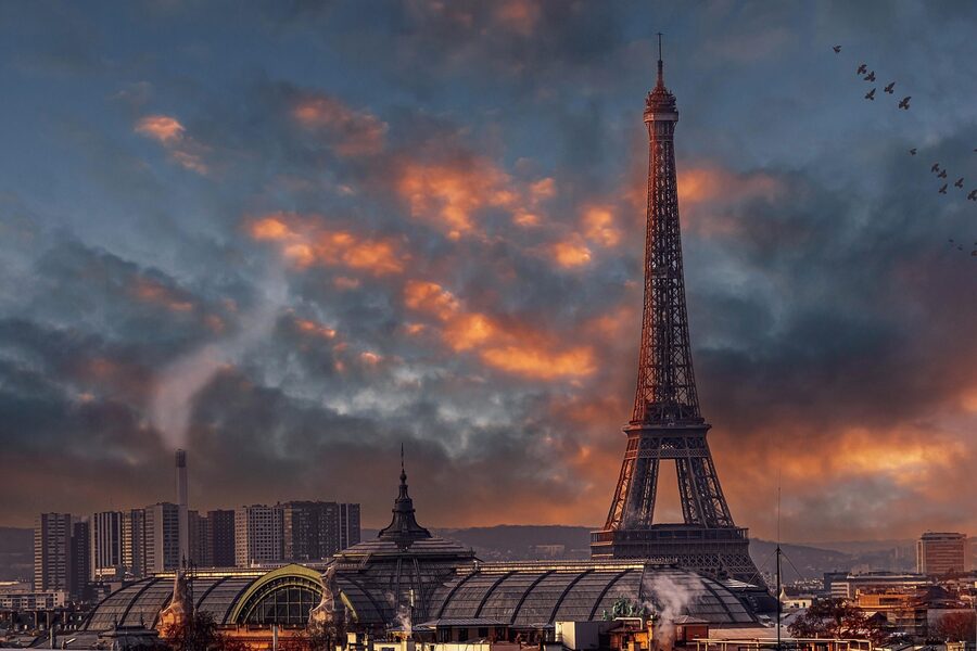 Eiffel Tower at sunset over Paris rooftops