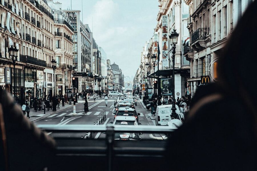 View from the upper deck of a double-decker bus on a Paris street