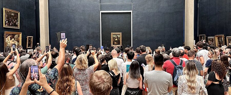 Crowd around the Mona Lisa at the Louvre Paris