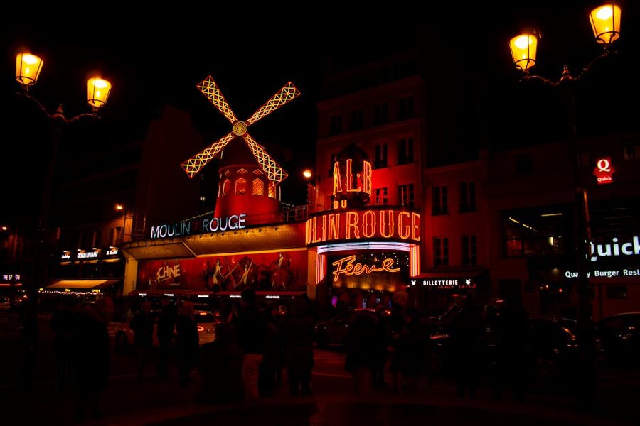 Moulin Rouge night scene illuminated Paris