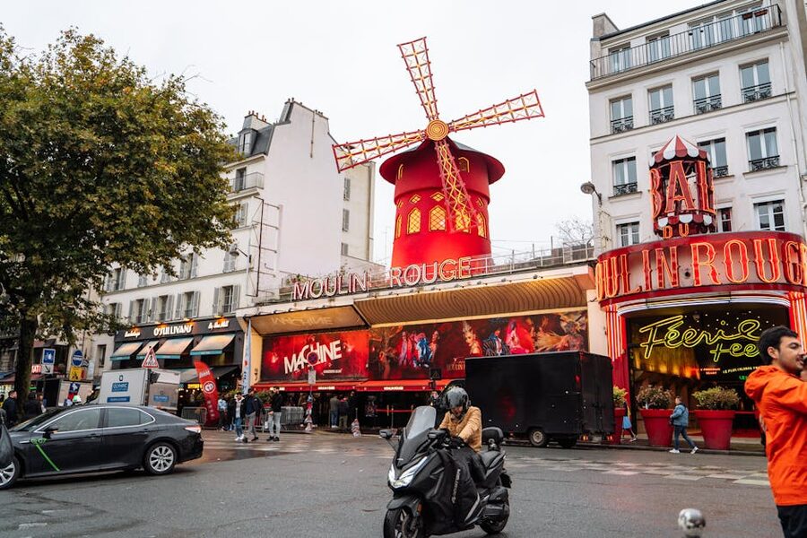 Moulin Rouge street view evening crowd Paris
