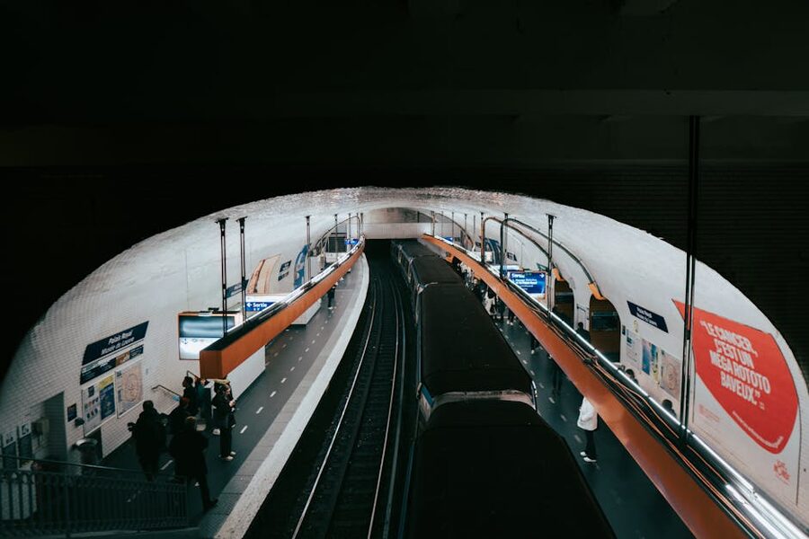 Busy Paris metro platform with commuters