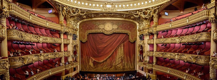 Red theatrical curtain at the Palais Garnier opera stage